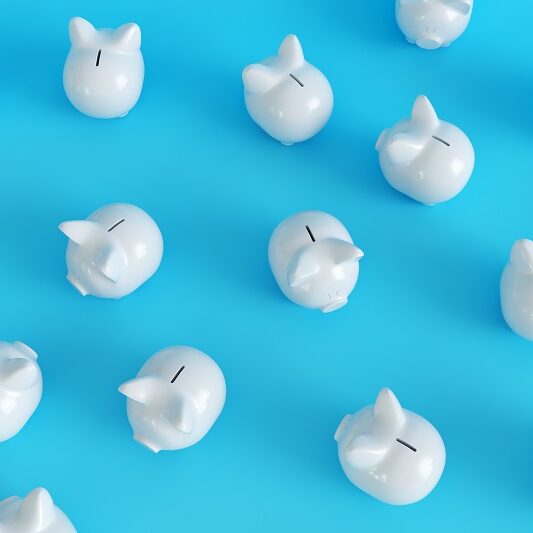 Many,White,Piggy,Bank,On,Blue,Background.,Top,View.,Minimal